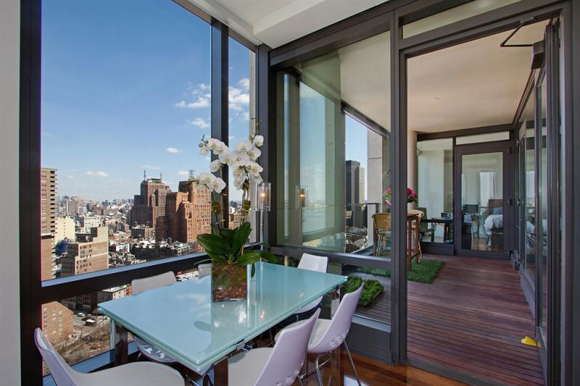 Views of the balcony and Tribeca skyline from a 101 Warren Street luxury apartment.